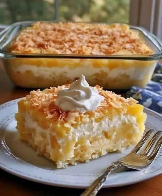 Creamy Coconut Pineapple Poke Cake with Whipped Cream Topping